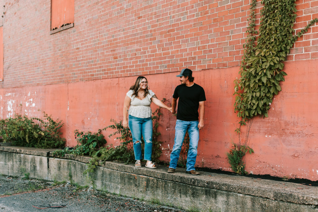 engagement-photo-pose-morris-photography-walking-hand-in-hand-downtown-Missouri