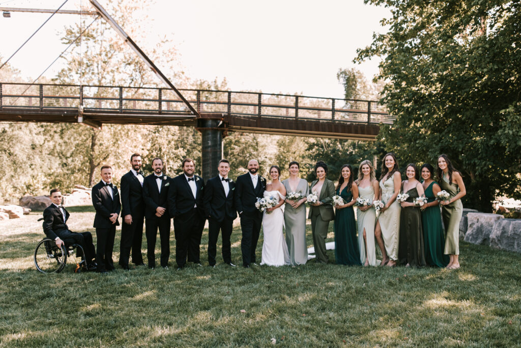 Entire black tie wedding party at Finley Farms dressed in tuxes and floor length gowns
