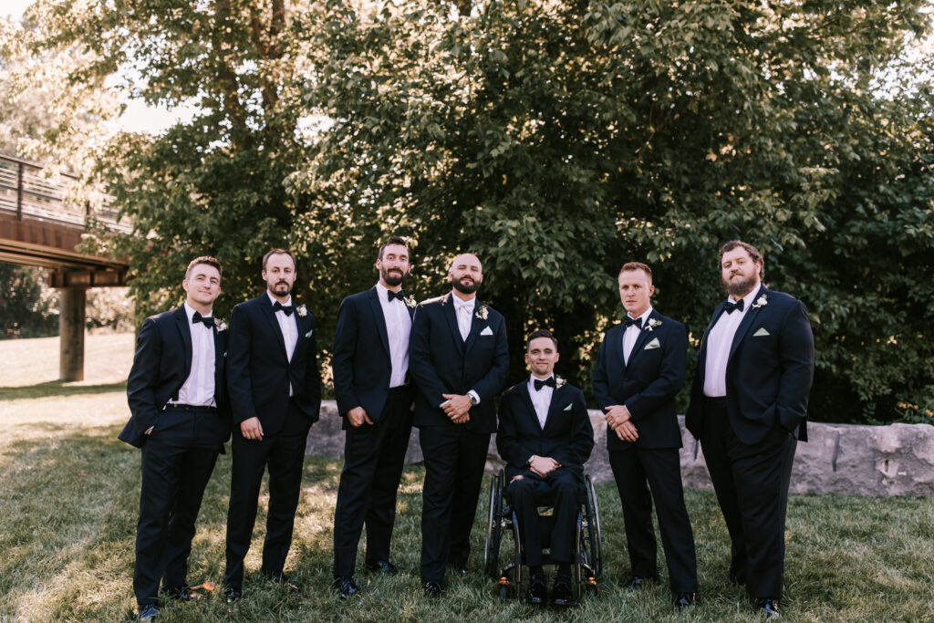 Groom and groomsmen at Finley Farms dressed in black tie wedding attire