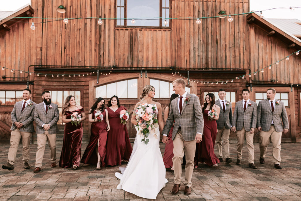 Bride and groom in front of their wedding party at Mighty Oak Lodge in Lebanon, Missouri.