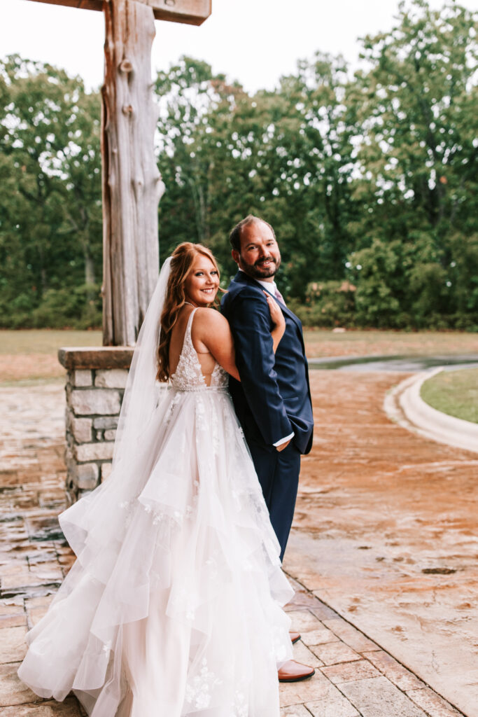Bride and groom portrait using the outdoor covered patio at Mighty Oak Lodge in Lebanon, Missouri.