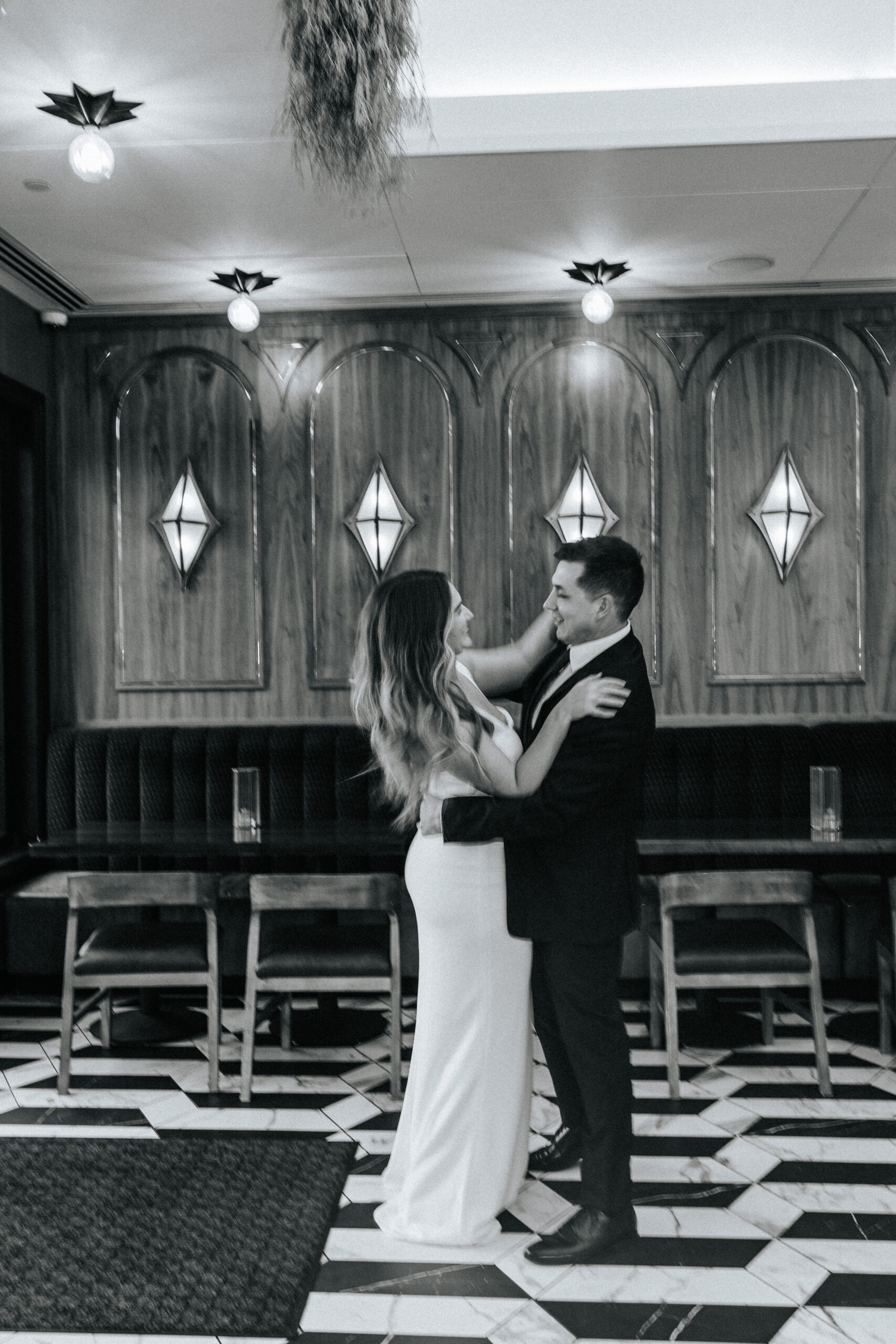 Bride and groom embrace at a Hotel Vandivort Wedding. 