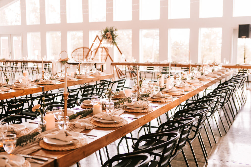 Table set up for a wedding reception at The Atrium Wedding Venue in Branson, Missouri. Photo by Branson wedding photographer Bailey Morris.
