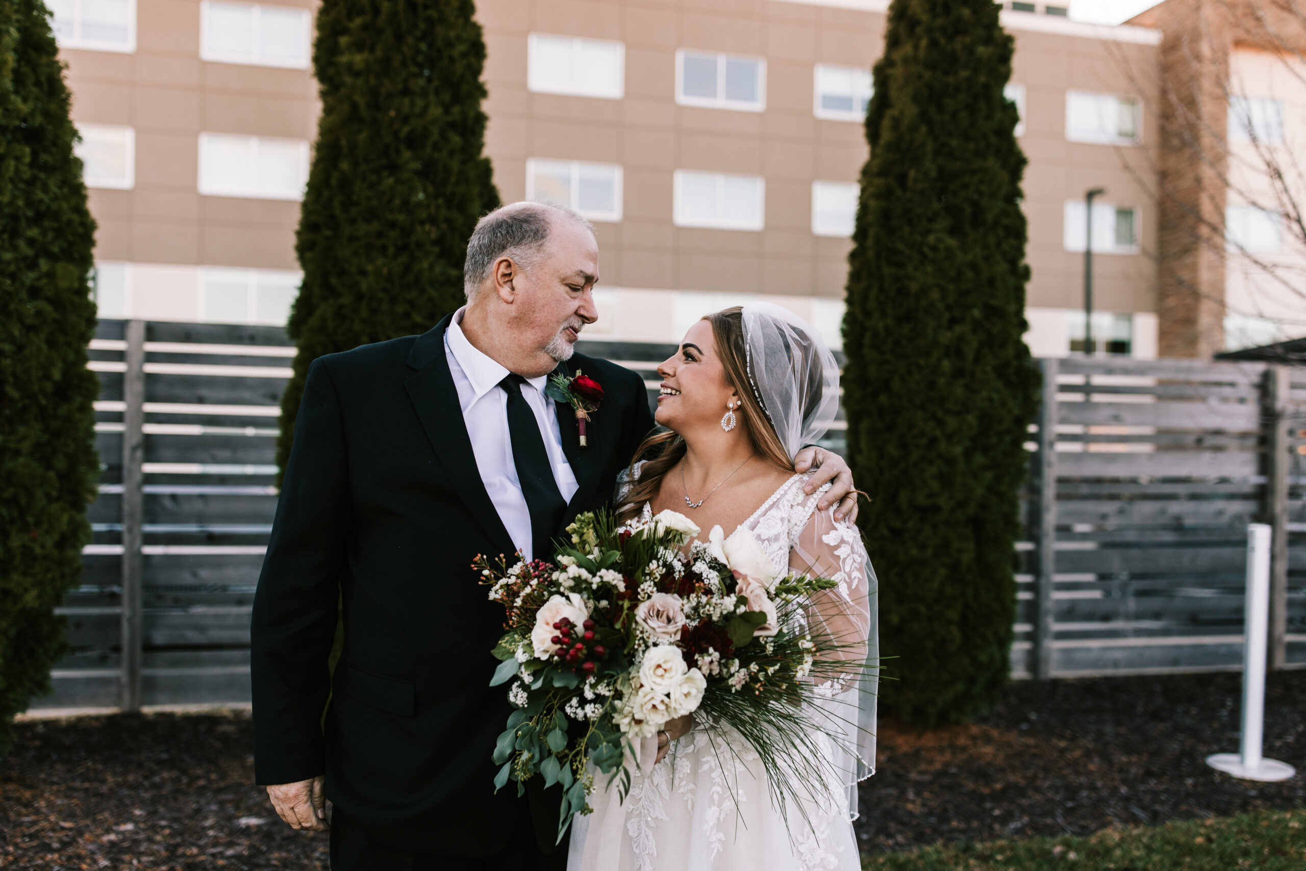 Father looking lovingly on his daughter - the bride- at a Springfield, Missouri wedding venue. Photo by Bailey Morris wedding photography.