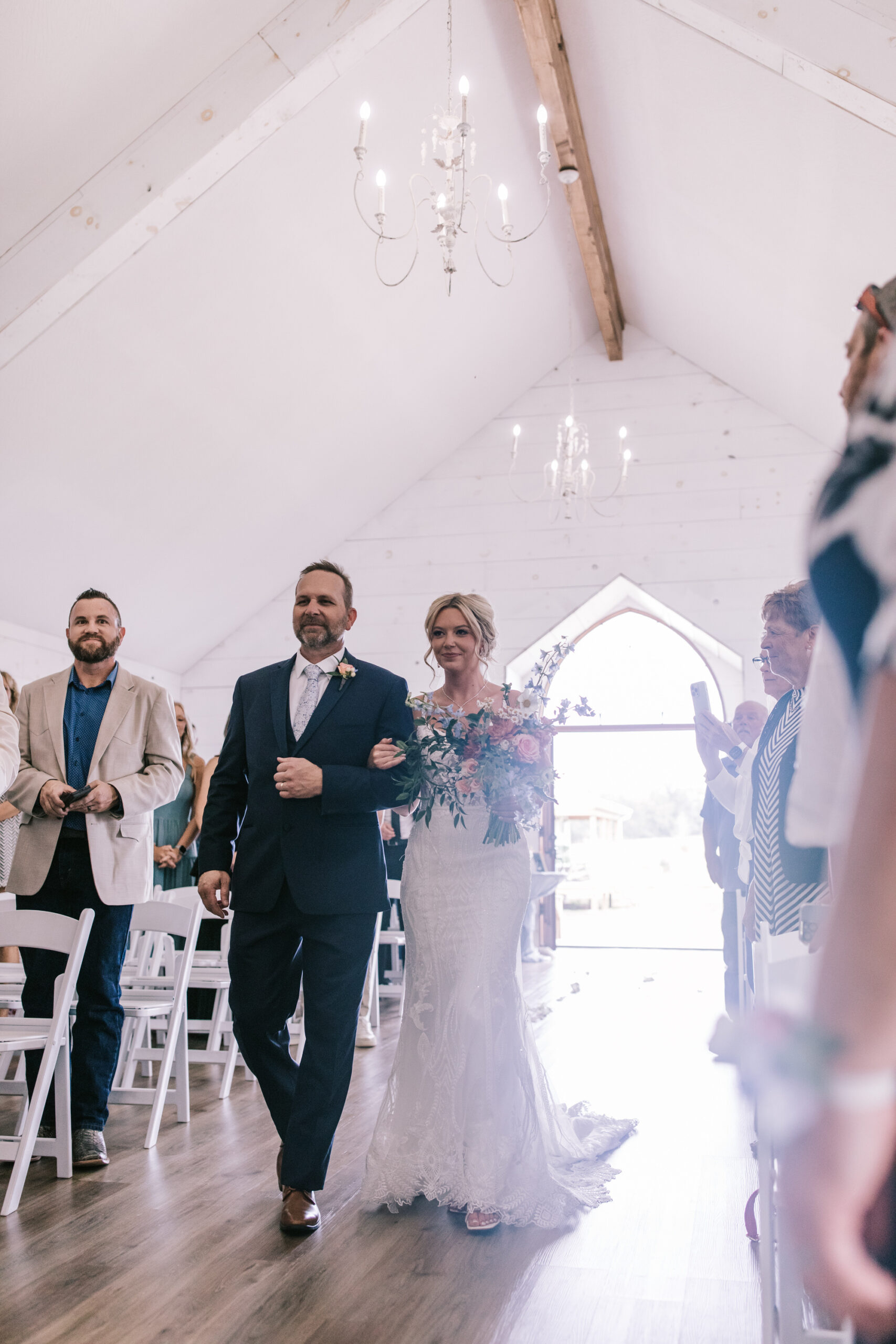 Father walks bride down the aisle at Sparrow Lane Wedding Venue in Willard Missouri. Photo by Bailey Morris Wedding Photographer.