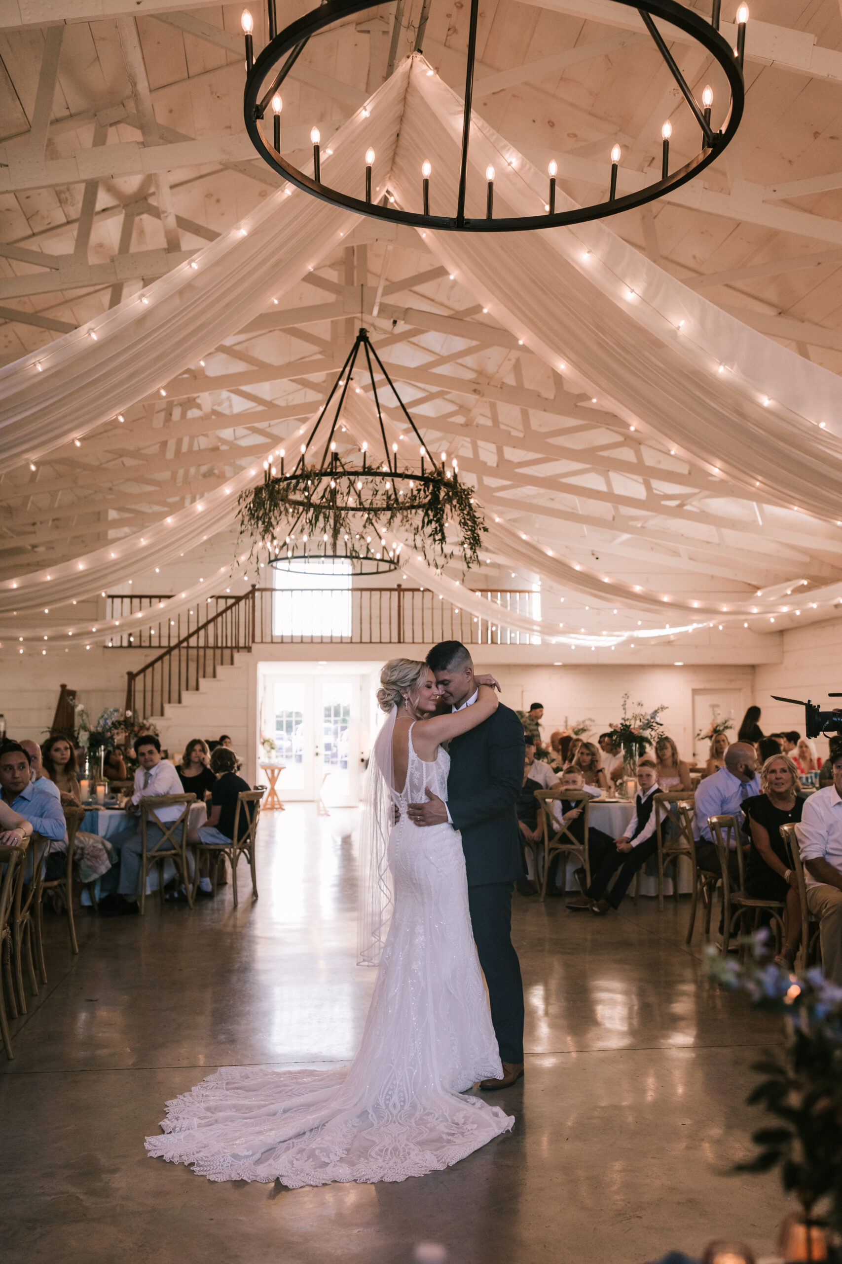 Bride and groom dance at their reception at Sparrow Lane Wedding Venue in Willard Missouri. Bailey Morris Wedding Photography. 