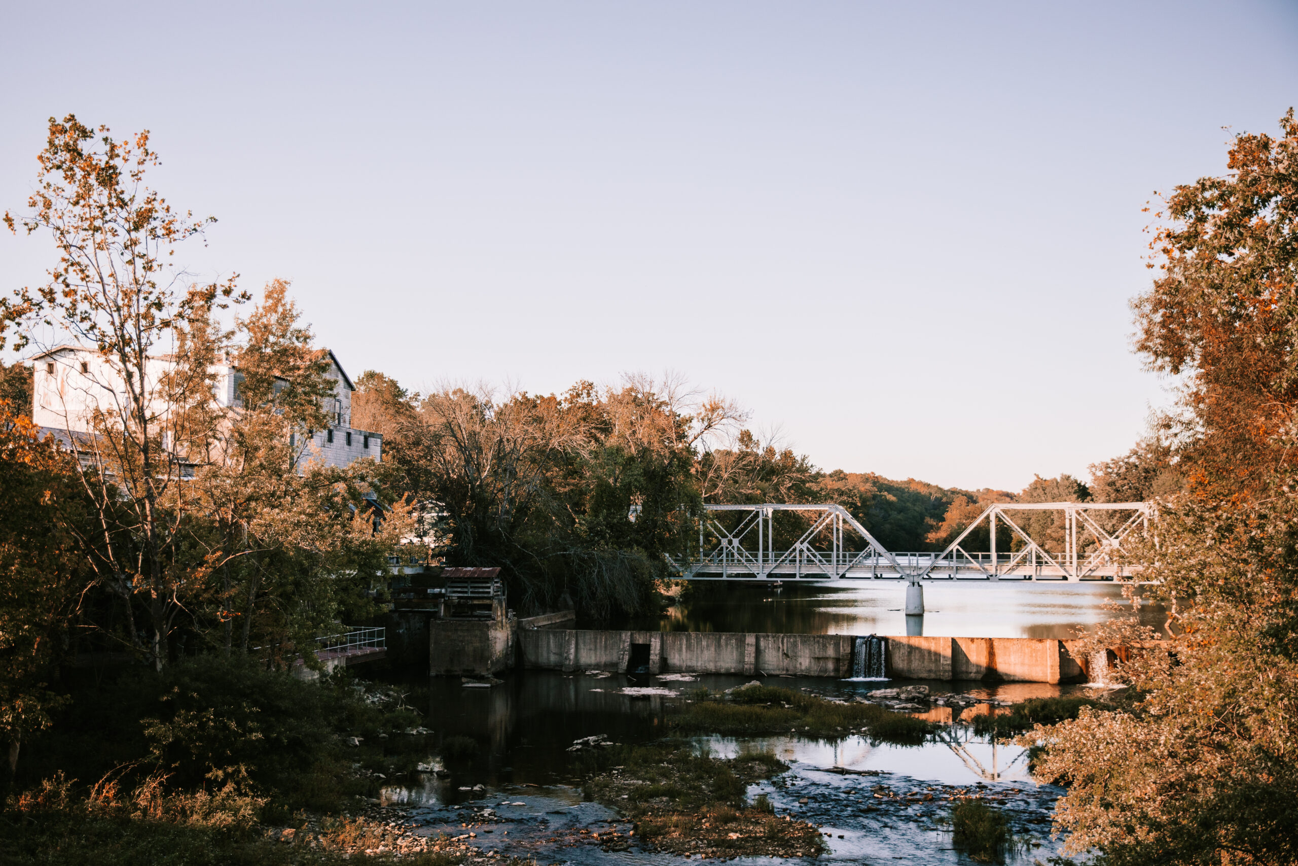 Landscape view of the Ozark Mill and the Riverside Bridge at Finley Farms. 