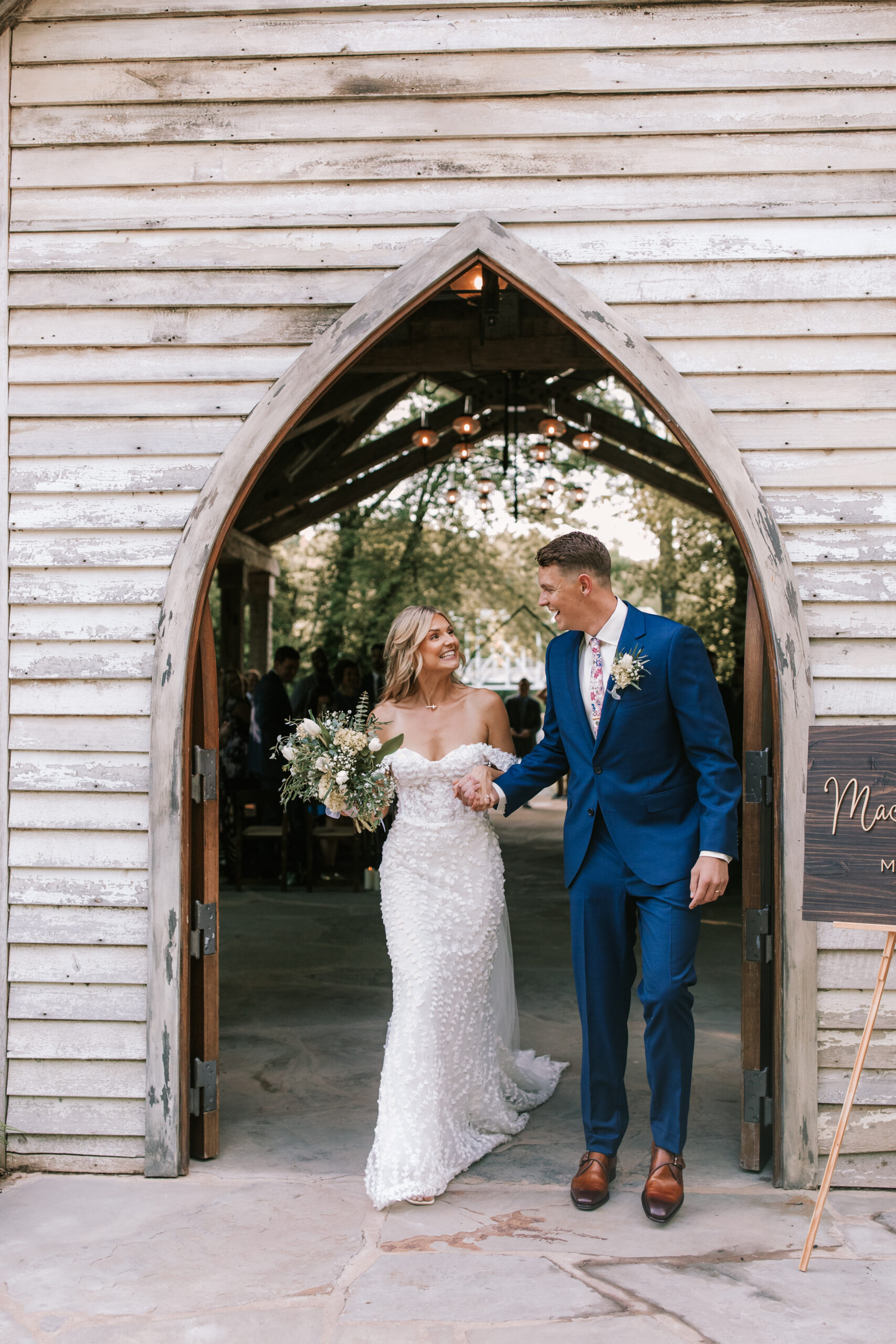 Bride and groom exit wedding ceremony at The Chapel at Finley Farms wedding venue.